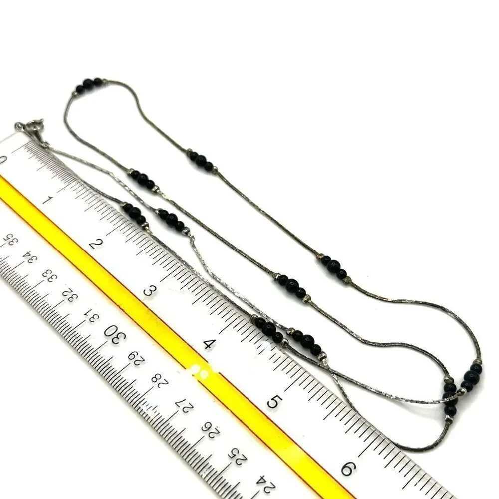 Black and silver tone long beaded necklace
